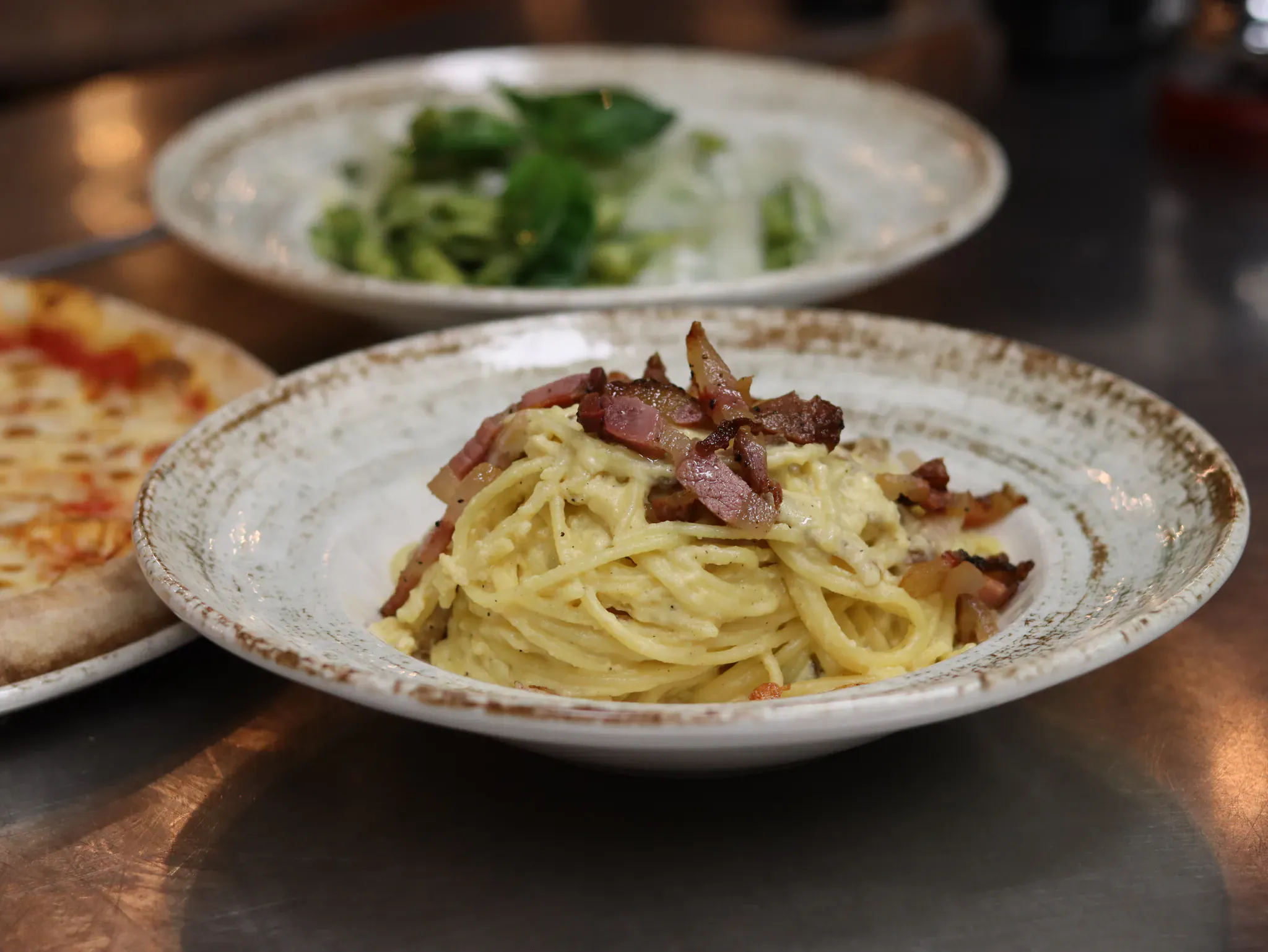 Plate of carbonara spaghetti served in the Pepe Zino dining room