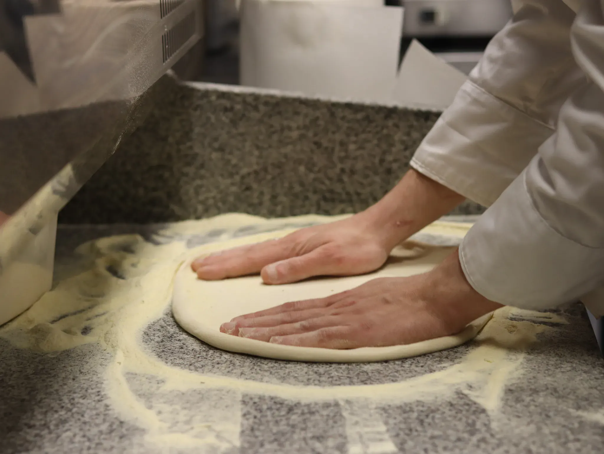 Pizza dough hand-stretched in the Pepe Zino kitchen