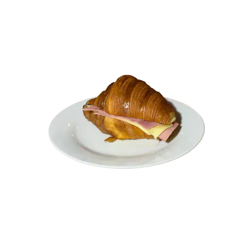 Croissant garni de jambon et fromage sur une assiette, à l'image des commerces de bouche de la rue des Martyrs