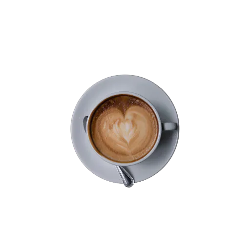 Cappuccino avec un coeur dessine dans la mousse de lait, prepare par un barista pres de Saint-Lazare