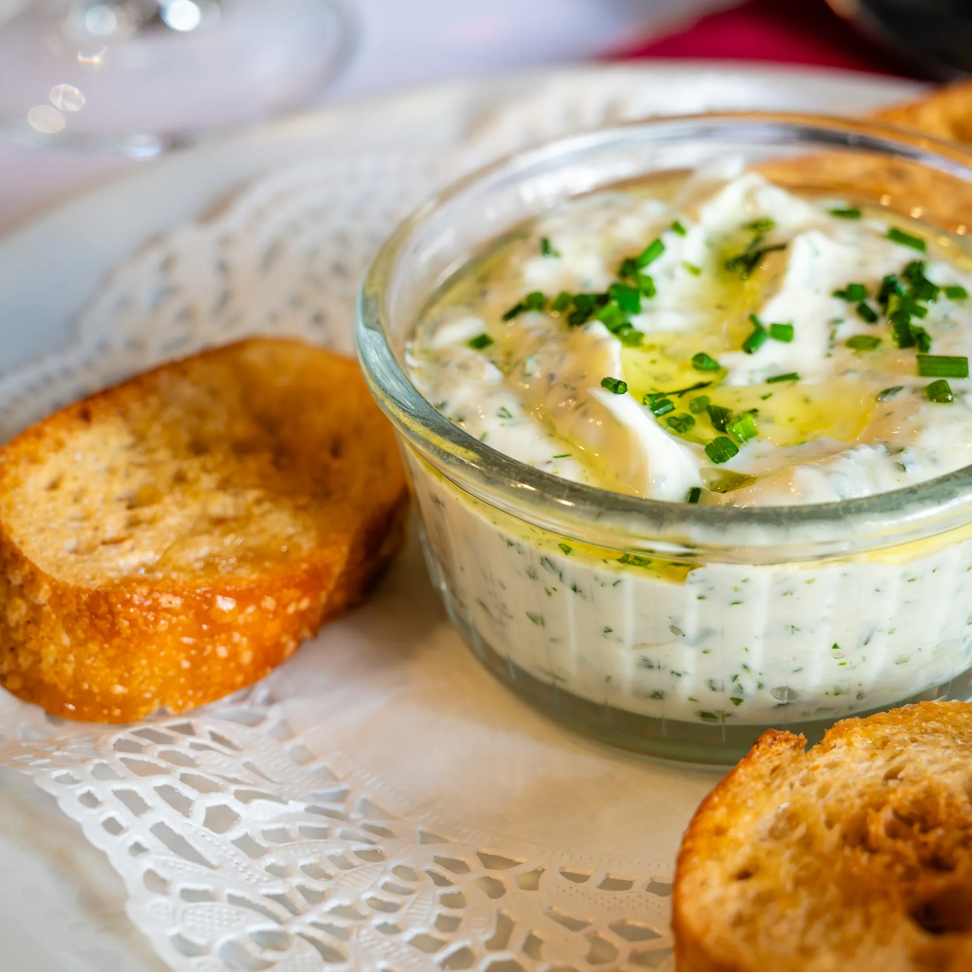 Cervelle de canut, fresh herbed fromage blanc, with toasted bread.