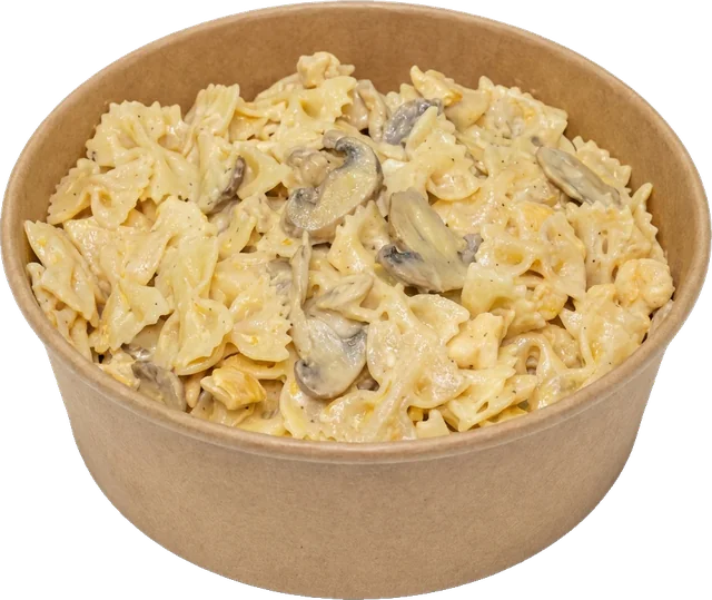 Pâtes farfalle à la sauce blanche crémeuse et aux champignons dans un bol kraft du Snack YS Le 13