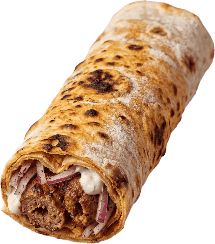Un durum roulé dans son pain lavash, une extrémité ouverte sur la viande adana et les oignons rouges